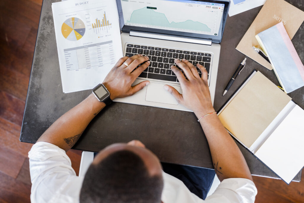 Man using laptop at desk